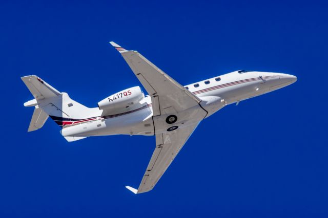 Embraer Phenom 300 (N417QS) - A NetJets Embraer Phenom 300 taking off from PHX on 2/10/23 during the Super Bowl rush. Taken with a Canon R7 and Tamron 70-200 G2 lens.