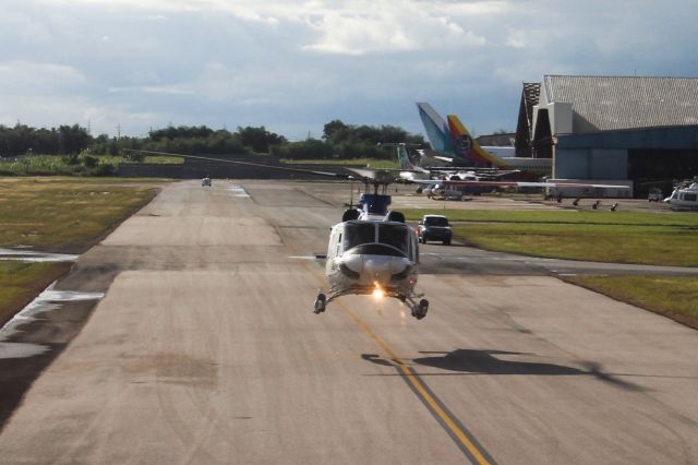 HELI — - A helicopter hovering over the taxiway at TTPP. Taken from our American Airlines Boeing 767-323ER, flight 1668, on December 10, 2012.