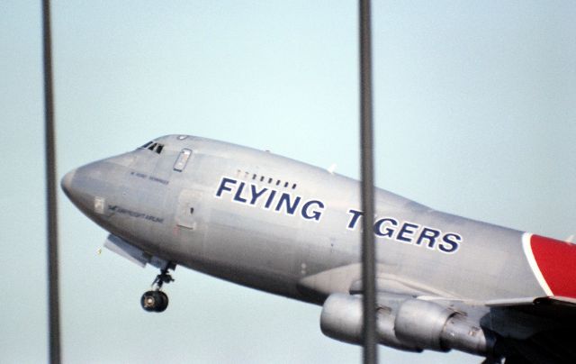 — — - KSFO Flying Tigers 747 departing 28R passing the terminal screaming out for HKG- this was a 1000mm lens shot.
