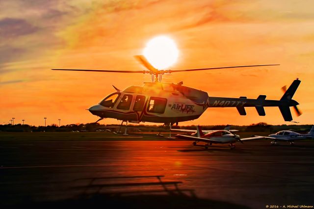 Bell 407 (N407TX) - Take off in the sunset 