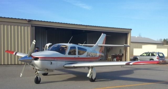 Rockwell Commander 114 (N4928W) - At a hangar