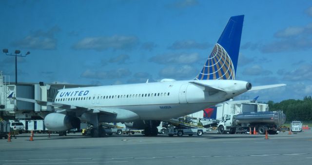 Airbus A320 (N448UA) - Shown at the gate is this 1998 United Airlines Airbus 320-232 in the Spring of 2022. Photo taken through the window of the regional aviation museum at the airport.