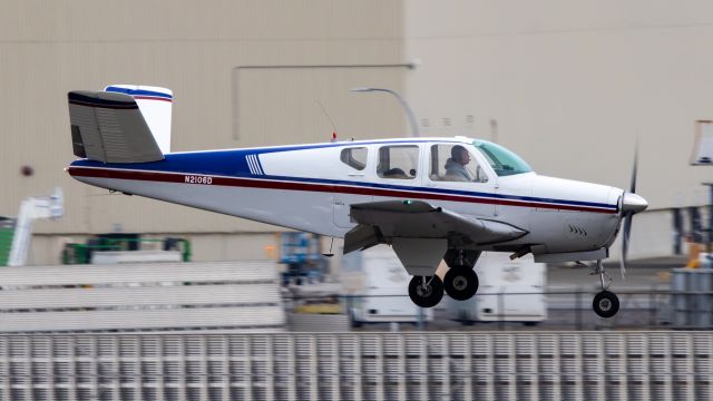 Beechcraft 35 Bonanza (N2106D) - A V Tail Bonanza about to touchdown at Paine Field during my first visit to the west coast for the weekend.br /br /Taken on 2-13-2023br /Canon EOS T8i Sigma 100-400mm