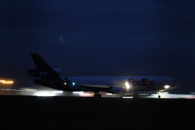 Boeing MD-11 (N617FE) - A FedEx McDonnell Douglas MD-11F taking off on runway 22 at London Stansted Airport.br /br /Location: London Stansted Airport.br /Date: 12.10.22 (dd/mm/yy).