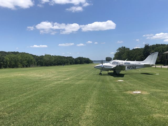 Beechcraft 55 Baron (N123AK) - Grass strip at Cedar Mills on Lake Texoma 