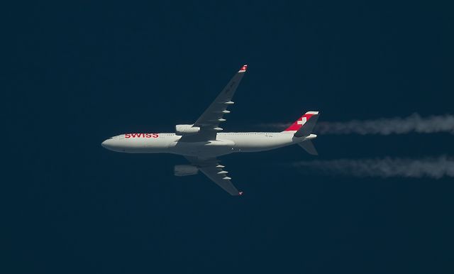 Airbus A330-300 (HB-JHA) - 29/12/2015 Swissair A333 HB-JHA Passes overhead West Lancashire,England,UK at 38,000ft working route GVA-JFK SWR22B.br /Photo taken from the ground.br /Pentax K-5.