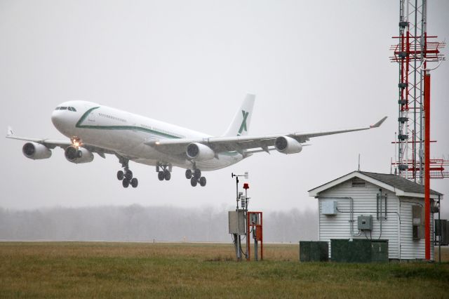 Airbus A340-300 (9H-BIG) - arriving from Granada, Spain...in heavy snow showers..Air X Charter 61J