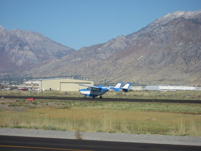 Cessna Super Skymaster (N2672S) - Landing with Spectrums Jet production facility in the Background at the Spanish Fork/Springville, Utah Airport.