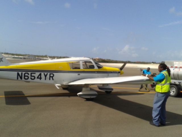 Piper Cherokee (N654YR) - May 24,2015 refueling at Exuma airport (GGT) to depart for arrival at Puerto Rico San Juan Isla Grande Airport (SIG)