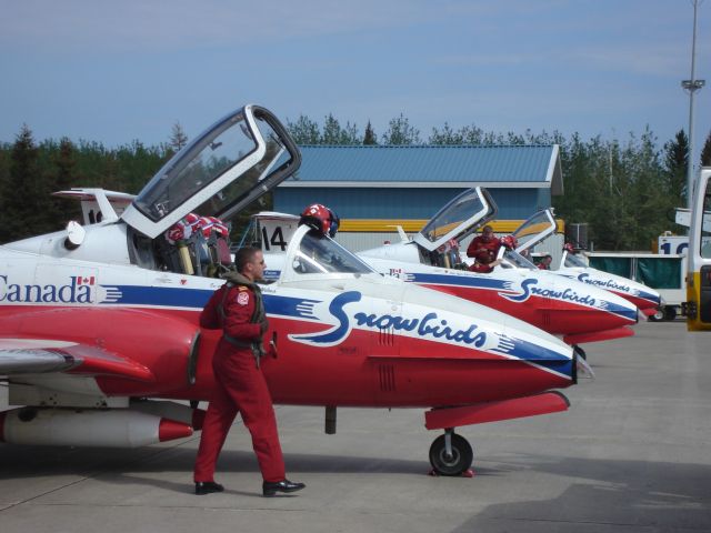 — — - Canadian Forces Snowbirds deplane for a fuel stop at Fort McMurray Airport in Alberta, Canada enroute to an airshow at Yellowknife, N.W.T. in July 2008