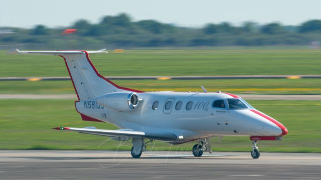 Embraer Phenom 100 (N581JS) - The 100th Embraer Phenom 100 made, with special 100th livery, taxis down Taxiway Hotel to runway 35L at EFD on 3/29/2021