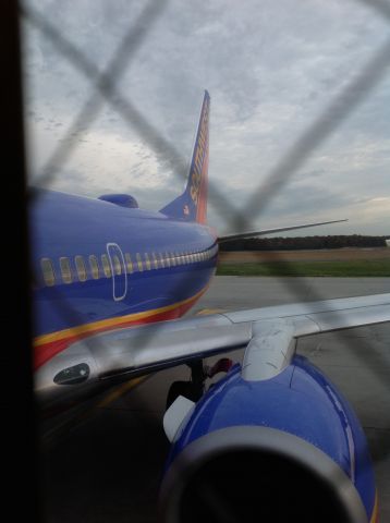 Boeing 737-700 (N200WN) - Yes, the window is in the way, but to be honest it kinda makes the picture look better.