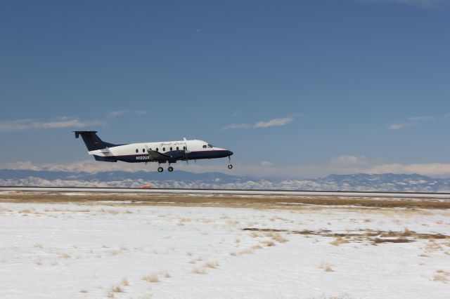 Beechcraft 1900 (N122UX) - Landing on 35L at DIA.