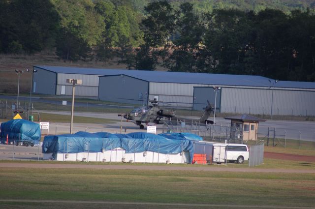 — — - AH-64D at CXO, taxiing out for takeoff.