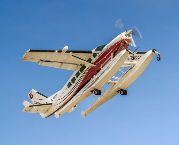 Cessna Caravan (C-GCGA) - Cessna Caravan (208) of Cameron Air made three attempts to land between inbound commercial jets. Here they peel off and over our heads and go around for another try...