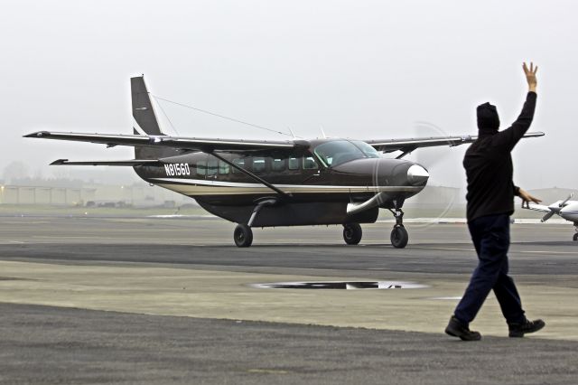 Cessna Caravan (N81560) - One of two identical new 2013 Caravans arriving Hillsboro within minutes of each other from Wichita.  (N81560, N81562)  12-26-13