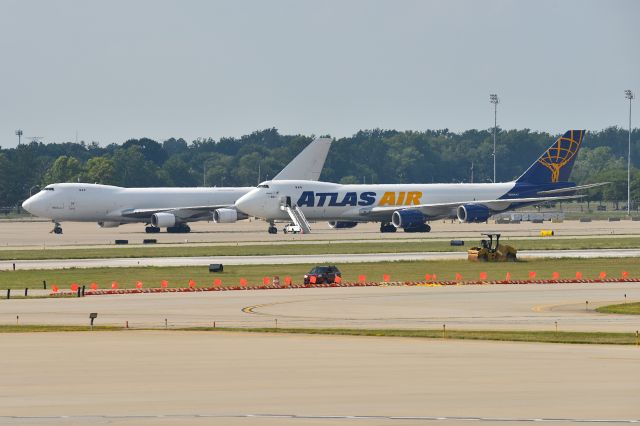 BOEING 747-8 (N860GT) - Sister ship B-747-400F N406KZ behind her. Both were ORD WX Diversions from previous evening when crews timed out and had to RON.