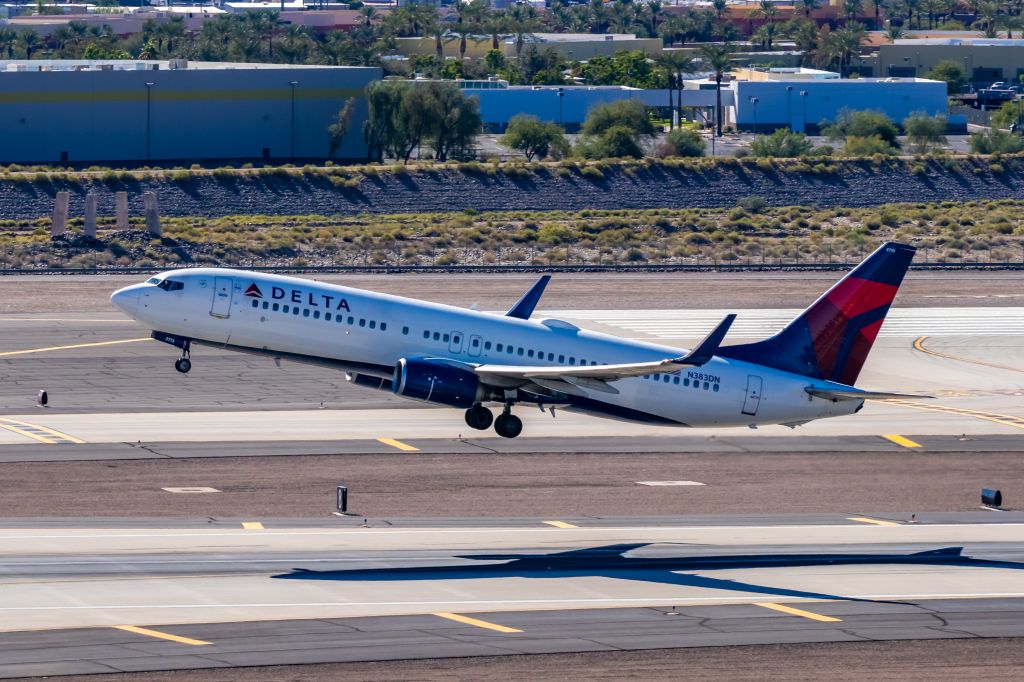 Boeing 737-800 (N383DN) - Delta Airlines 737-700 taking off from PHX on 11/6/22. Taken with a Canon 850D and Tamron 70-200 G2 lens.