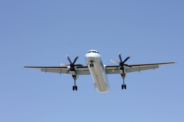 de Havilland Dash 8-400 (POE415) - PHOTO TAKEN AT THE END OF RUNWAY 24 LEFT