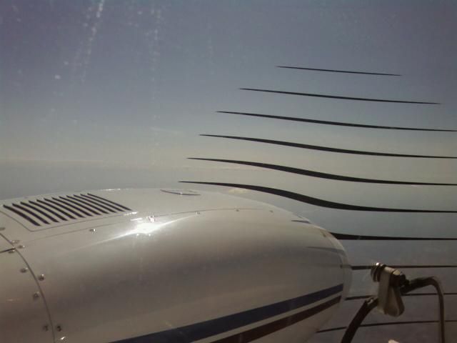 Piper Seneca (N34KG) - Enroute, used my cell phone to take this picture.  I had no idea the prop would turn out like this!