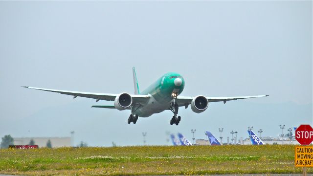 Boeing 777-200 (N890FD) - BOE061 climbs from runway 16R on 7/17/12 for a flight to KPDX where it will be painted.