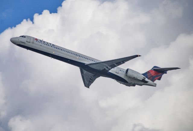 McDonnell Douglas MD-90 (N947DN) - The MD-90 rocketing out of ATL against a very contrasting sky.  Sure do miss the -90s!