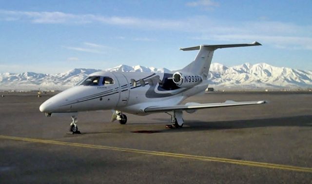 Embraer Phenom 100 (N999RN) - Looking southwest from the Salt Lake Air Center ramp, morning, February 1, 2010.