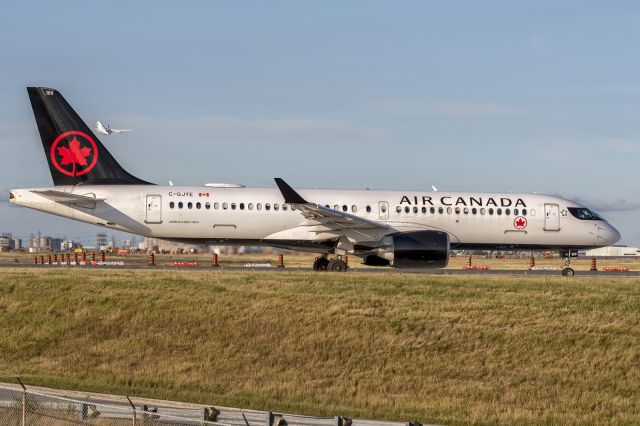 Airbus A220-300 (C-GJYE) - 18th July, 2022: Air Canada Airbus A220-300 holding short of runway 06R at Toronto's Pearson Airport as Lufthansa B744 departs for Frankfurt. 