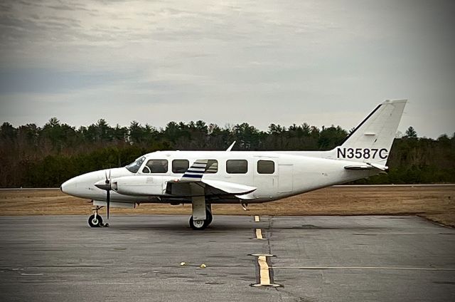 Piper Navajo (N3587C) - Sitting outside of terminial