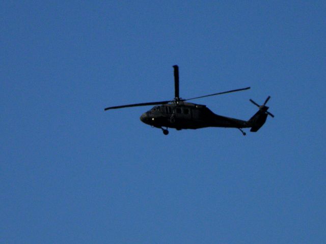 Sikorsky S-70 (02-3345) - Army 23345, A Kentucky Army National Guard UH-60, heads northward after flying the approach to RWY 22 at Blue Grass Airport (KLEX)...