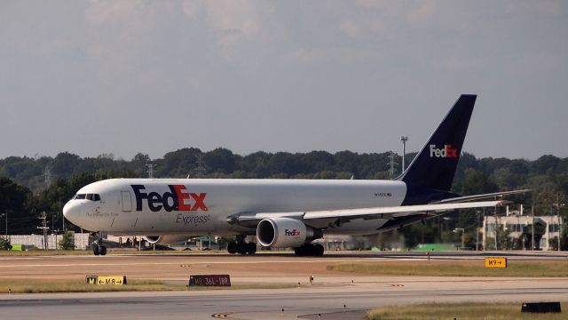 BOEING 767-300 (N110FE) - "Margo" taxis to 18R for departure.