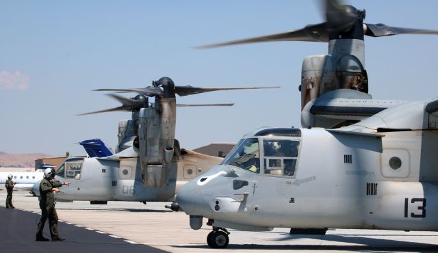 Bell V-22 Osprey (16-8350) - The pair of VMM 163 "Evil Eyes" MV-22B Ospreys that had been two of the weekends parade of military metal that visited RNO are clicked here during engine start. It was over 100 degrees air temperature when 168350 (#13) and 168018 (#06) powered up to depart, but when I got "washed" in the hot exhaust, it was way, way, waaaaay more than 100 degrees. And I DO mean "washed" ... the reason the port side prop of #13 cannot be seen in this photo is because I am literally standing directly in front of its forward arc - trying to hold the camera steady. What a rush ....