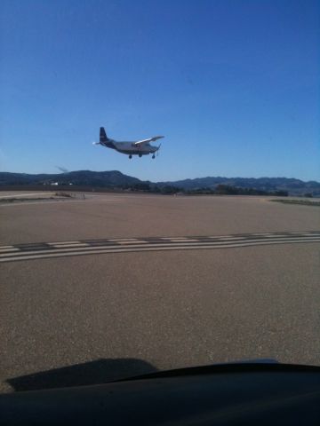 Cessna Caravan — - My husband coming in to land while I'm waiting to take off.