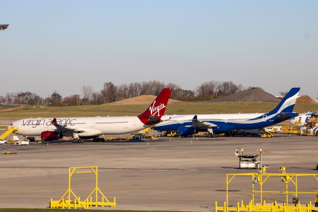 Airbus A330-300 (G-VLUV) - Virgin Atlantic and HiFly A330-300 sitting on the DHL ramp at CVG.