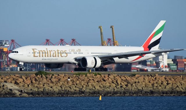 Boeing 777-200 (A6-ECN) - EK419 slowing down on Runway 34 L