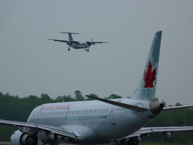 C-GCFK — - Air canada ERJ(CFHIQ)waits for Nav Canada dhc8 to land on RWY#25