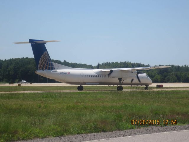 de Havilland Dash 8-400 (N328NG) - Taken: Public Viewing area @ KORFbr /Camera: Canon PowerShot ELPH 110 HS