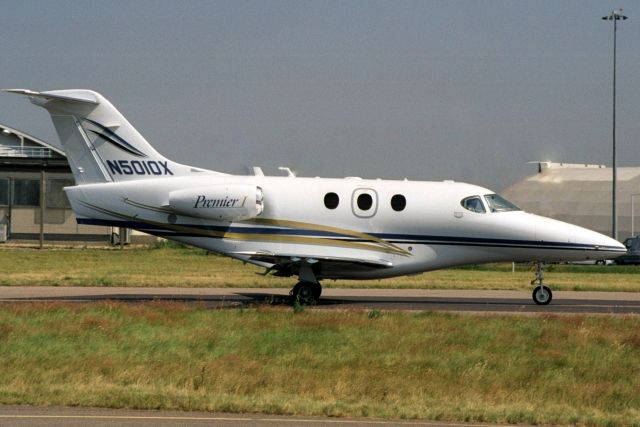 Beechcraft Premier 1 (N5010X) - Taxiing to depart rwy 26.  Written off 27-May-04 at KVGT.