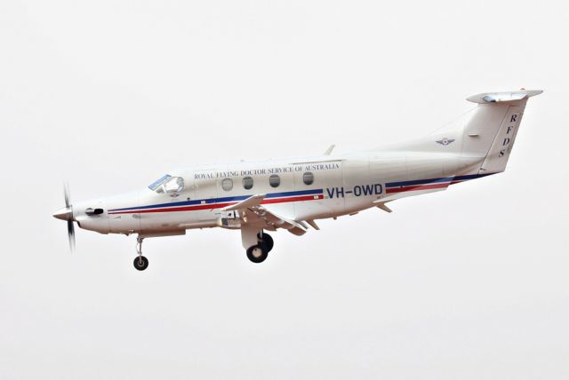 Pilatus PC-12 (VH-OWD) - On short final to RWY 09 on a stormy day