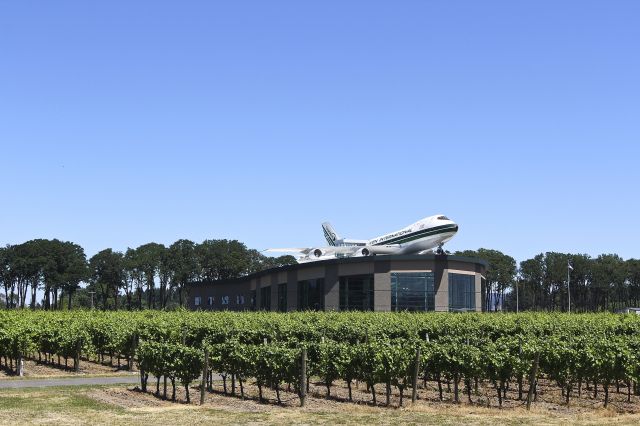 Boeing 747-200 (N481EV) - Evergreen B-747 atop a water park at the Evergreen Aviation Museum. Grapevines  growing in front of the watermark. 7-15-2013