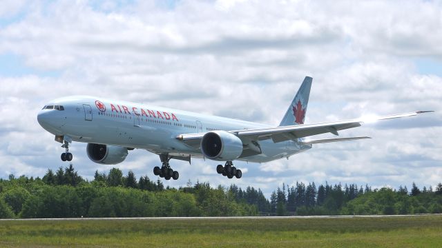 BOEING 777-300 (C-FIVW) - BOE416 from KARA on final approach to runway 34L on 6/2/13. (LN;1108 cn 42218). The aircraft was returning after having been painted.