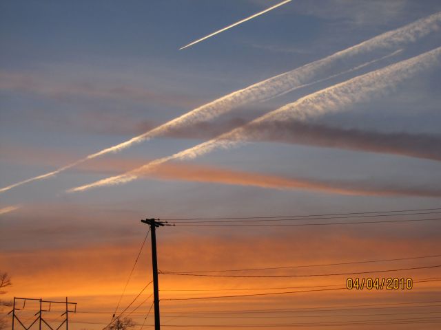— — - Aircraft Contrails just over Bridgewater NS after the sunset. April 4,2010