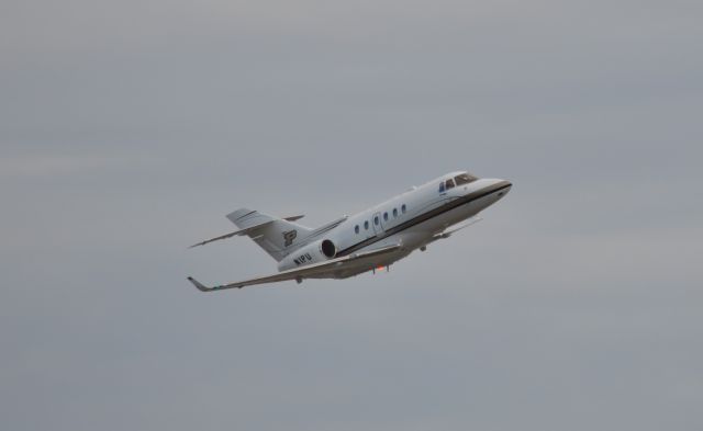 Hawker 800 (N1PU) - Departing Naples, FL 2/9/2022. photo taken from adjacent public park