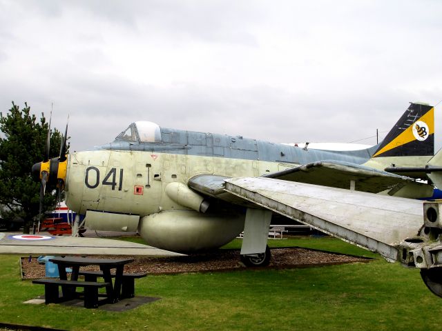 FAIREY Gannet (041) - This rather forlorn Fairey Gannet AEW (XL 497), which had operated with the British Fleet Air Arms 849 Squadron is now gently wasting away in the Dumfries Air Museum in southern Scotland. Note the large generator exhaust and radar bulge...  Photographed in February, 2011