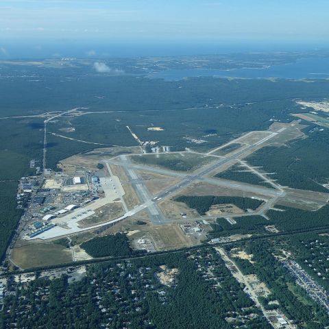 — — - Flying over Westhampton Beachs Francis S. Grebreski Airport