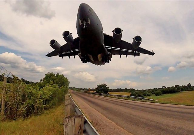 Boeing Globemaster III (05-5142) - An extreme close-up of USAF C-17, 05-5142, c/n, P-142 on short-final at Ft. McCoy taken from a frame-freeze from my GoPro Hero on 20 Jul 2017 during Warrior Exercise 86-13-01 (WAREX)/Exercise, a joint-service Combat Skills/Field Training exercise. The runway is extremely close to Perimeter Rd.