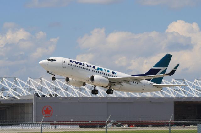 Boeing 737-700 (C-FWSV) - Departing on runway 24L