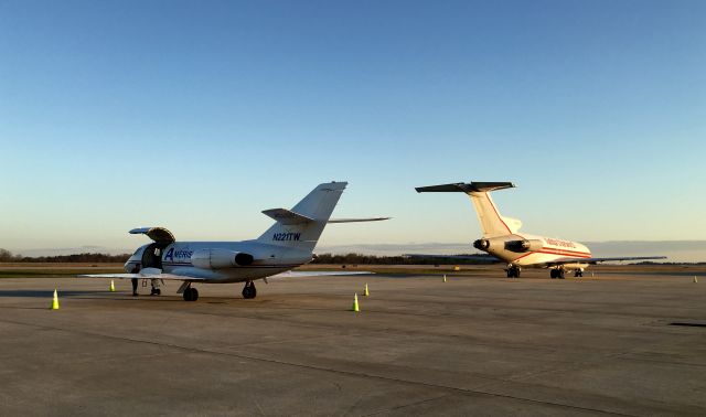 Dassault Falcon 20 (N221TW) - Two freighters in the early morning.