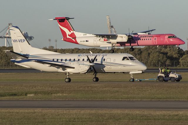 Saab 340 (VH-VEP) - VEP under the tow as QOH lands on its roof