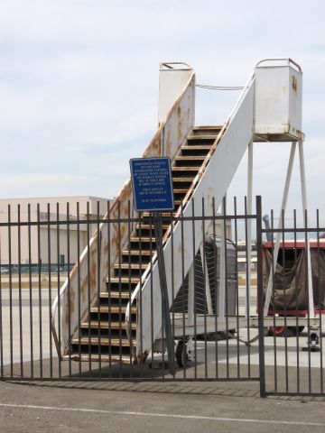 — — - Old rusted out stairway at Long Beach Airport